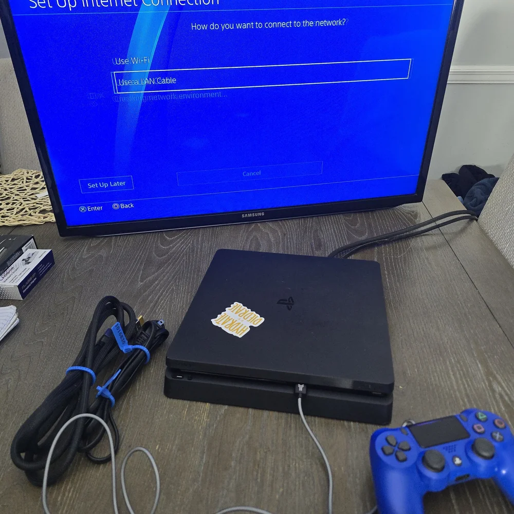 Sony PlayStation 4 Console with Black and Blue Controllers